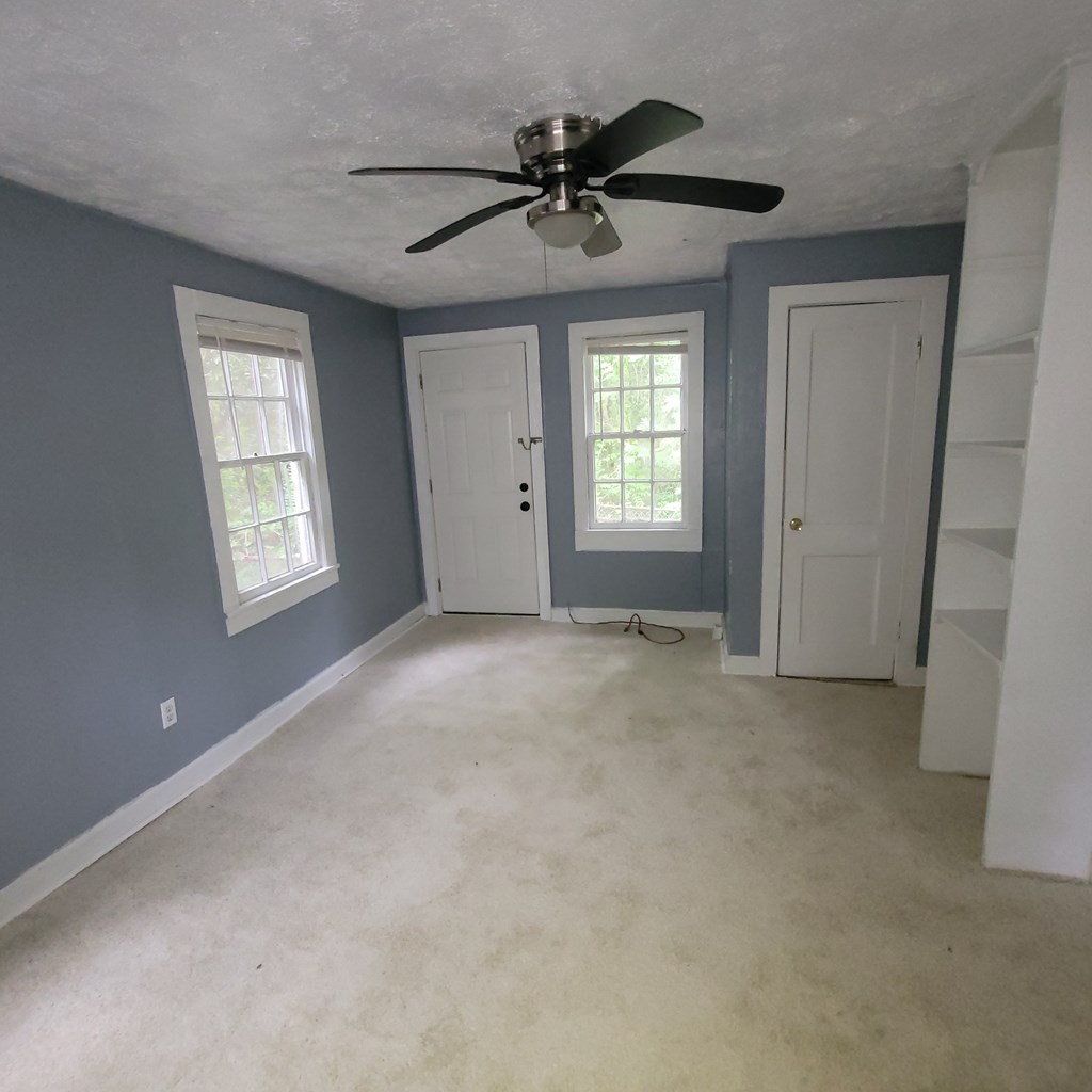 a view of an empty room with a window