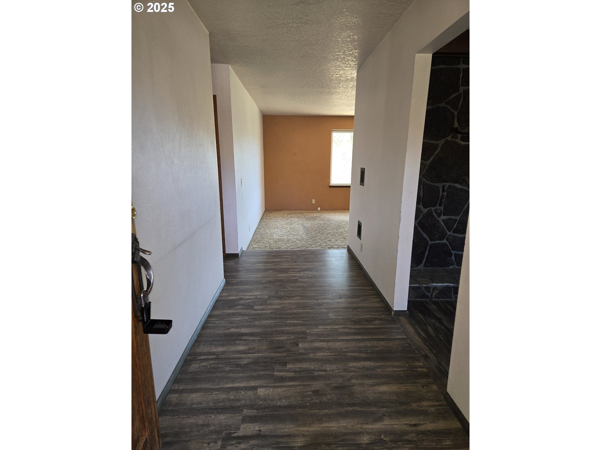 801 Ferguson Road John Day, OR 97845 - Photo 2 of 43 a view of a hallway with wooden floor