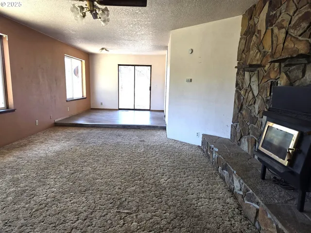 a view of an empty room with windows