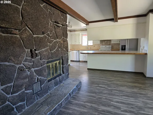 a kitchen with stainless steel appliances a sink and cabinets