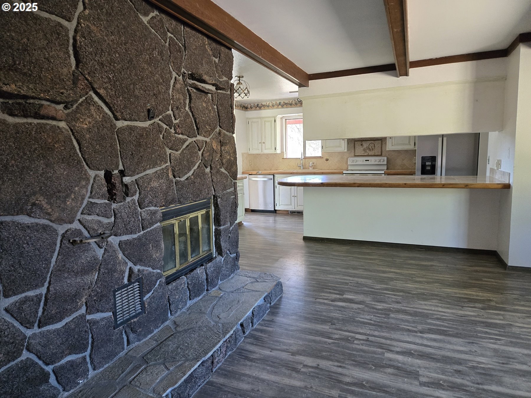 801 Ferguson Road John Day, OR 97845 - Photo 8 of 43 a kitchen with stainless steel appliances a sink and cabinets
