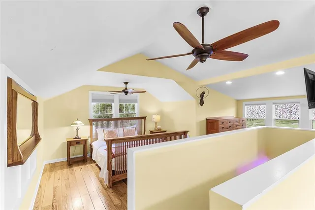 a living room with furniture and a mirror