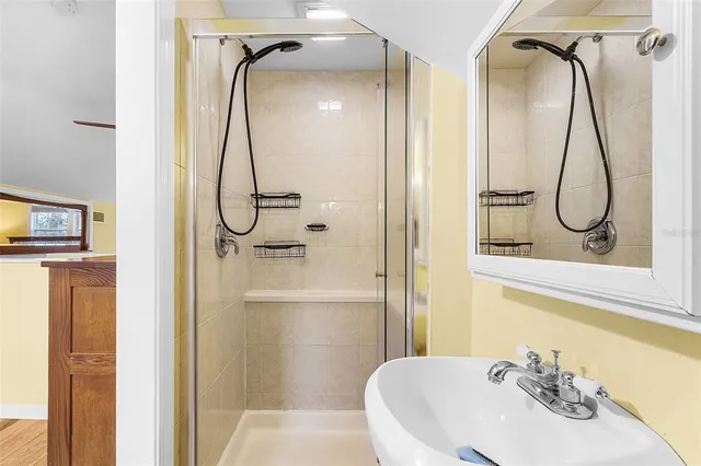 a living room with furniture and large windows