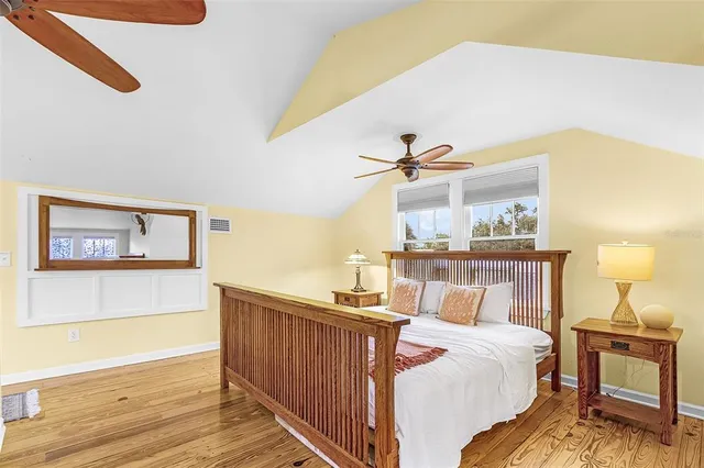 a living room with furniture and large windows
