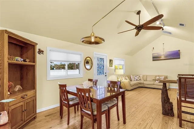 a view of a dining room with furniture and window