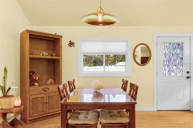 a view of room with furniture and wooden floor