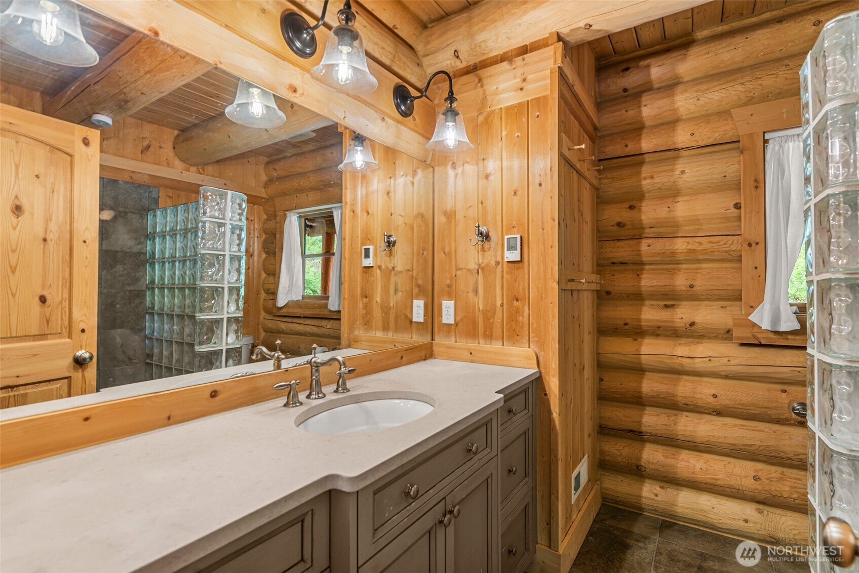 3888 Camas Creek Road Peshastin, WA 98847 - Photo 20 of 40 a bathroom with a sink and a mirror
