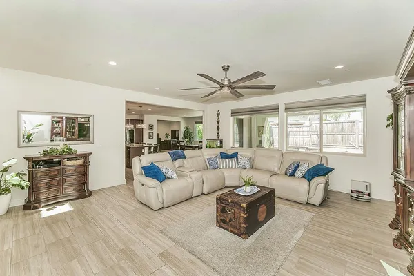 a living room with furniture and a large window
