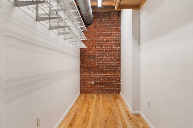 a bedroom with a bed and a chair