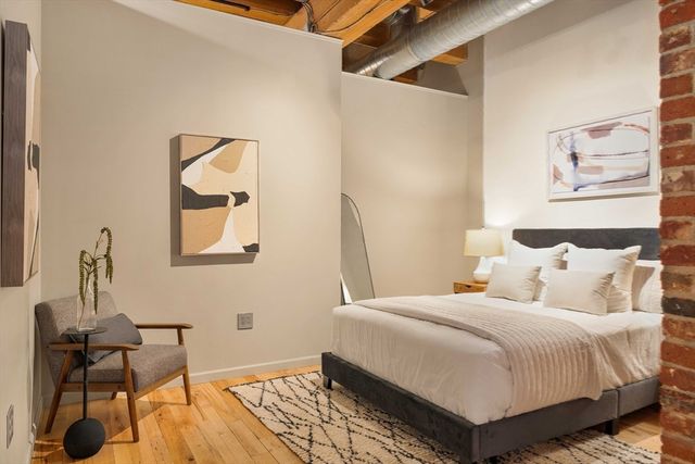 a large white bed in a white room