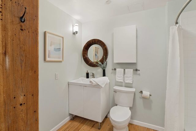 a bathroom with a shower and a toilet