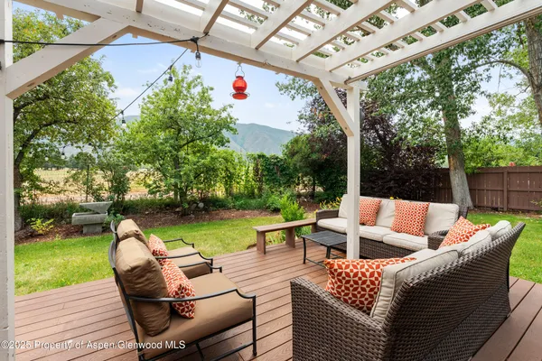 a view of yard with outdoor seating and green space