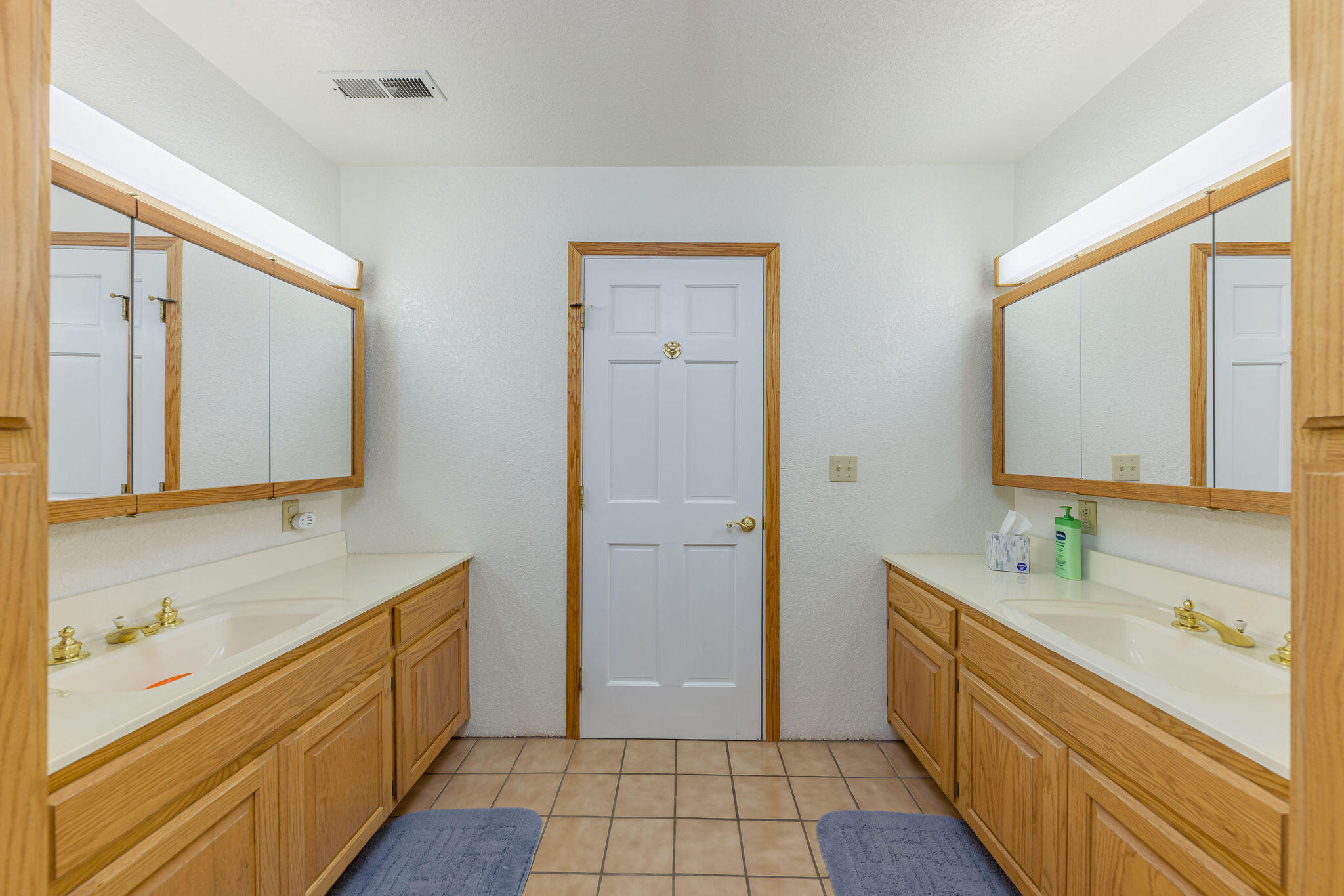 6790 Holland Loop Road Cave Junction, OR 97523 - Photo 29 of 151 a bathroom with a sink a mirror and a shower