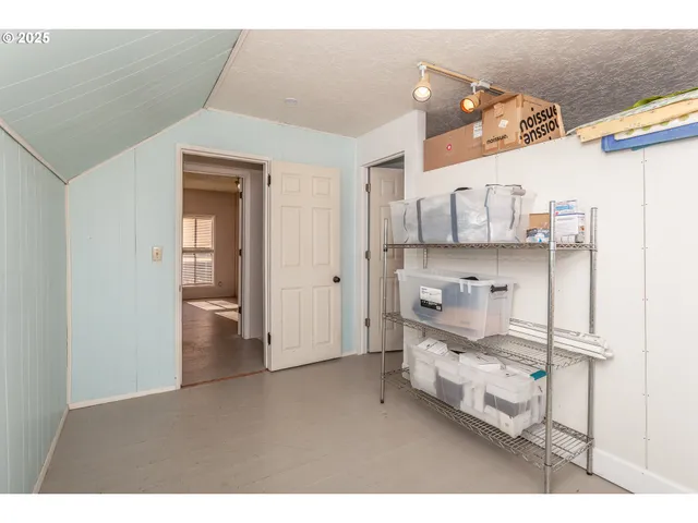 a kitchen view with cabinets and a sink