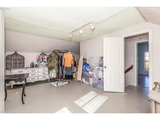 a white tub sitting in a bathroom next to a window
