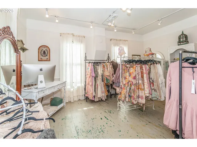 a view of a livingroom with furniture and a window