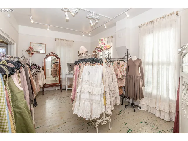 a view of a livingroom with furniture and a window