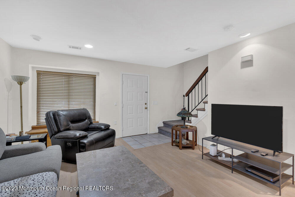 619 Sandra Place Brick, NJ 08724 - Photo 4 of 12 a living room with furniture and a flat screen tv