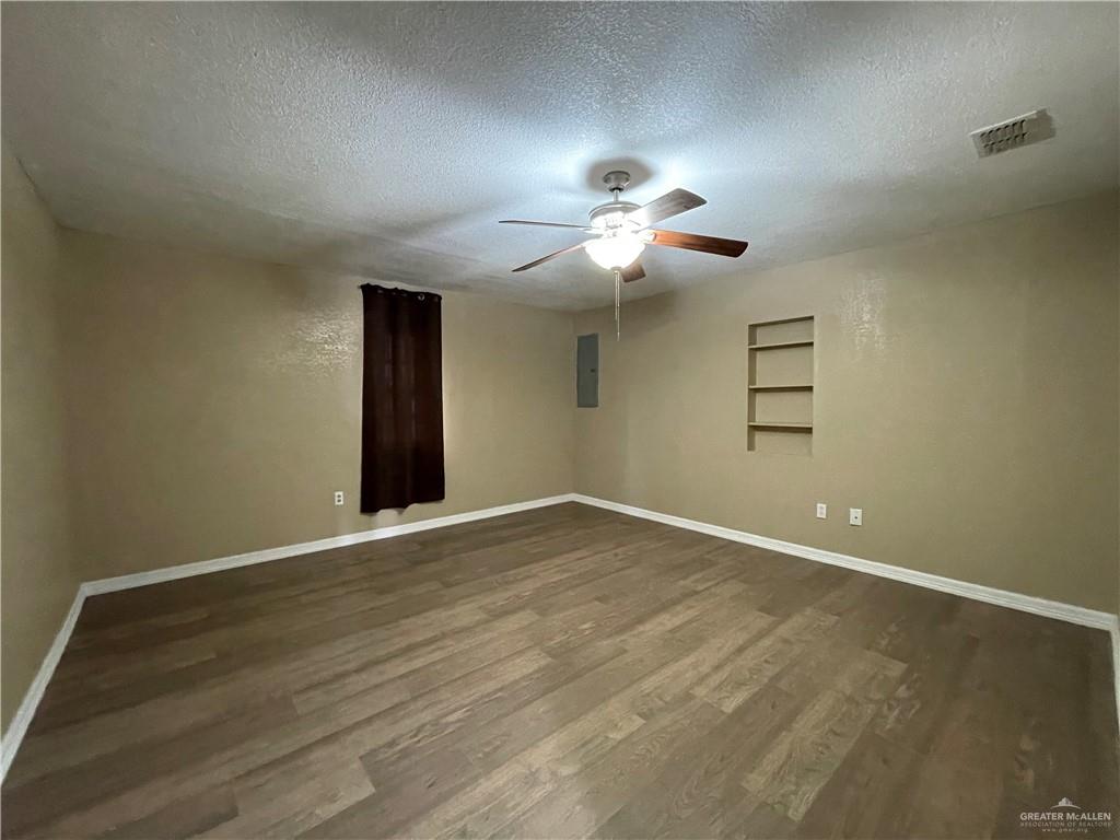 8006 Senecio Street Mission, TX 78574 - Photo 13 of 31 a view of an empty room with a window