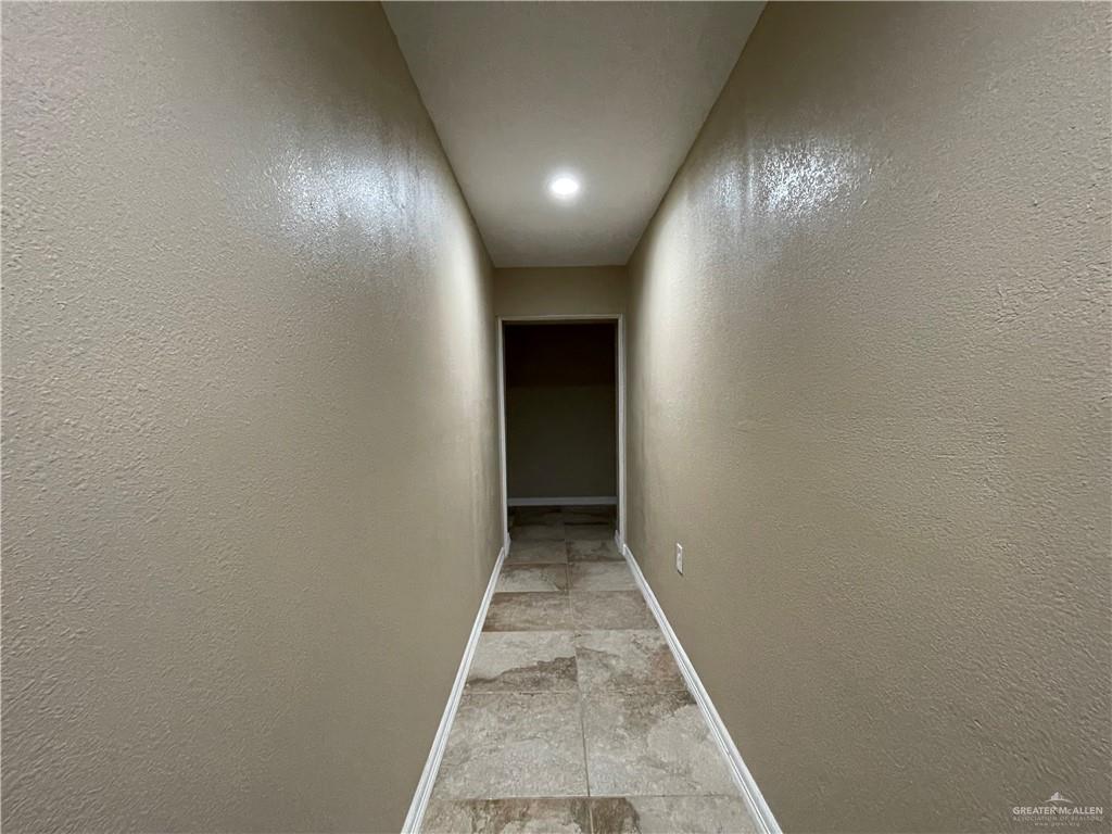 8006 Senecio Street Mission, TX 78574 - Photo 15 of 31 a view of hallway with wooden floor