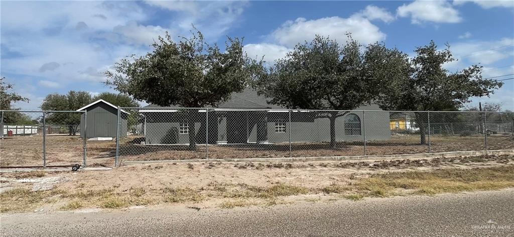 8006 Senecio Street Mission, TX 78574 - Photo 2 of 31 a view of a wooden house with a yard