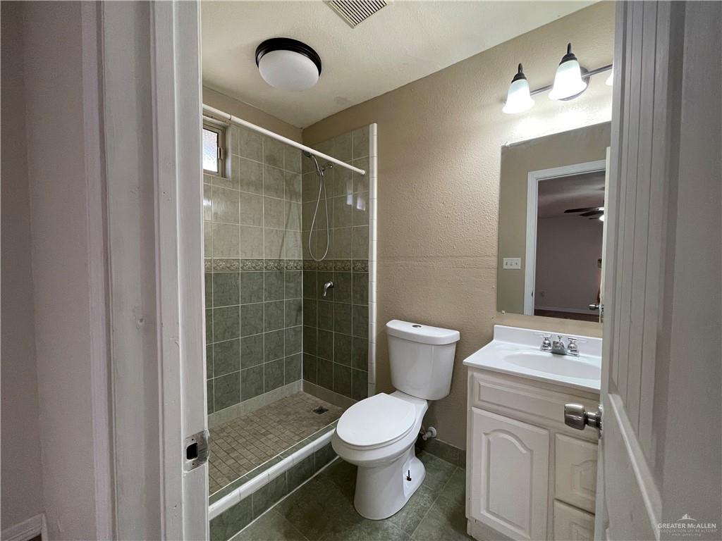 8006 Senecio Street Mission, TX 78574 - Photo 8 of 31 a bathroom with a toilet sink and shower