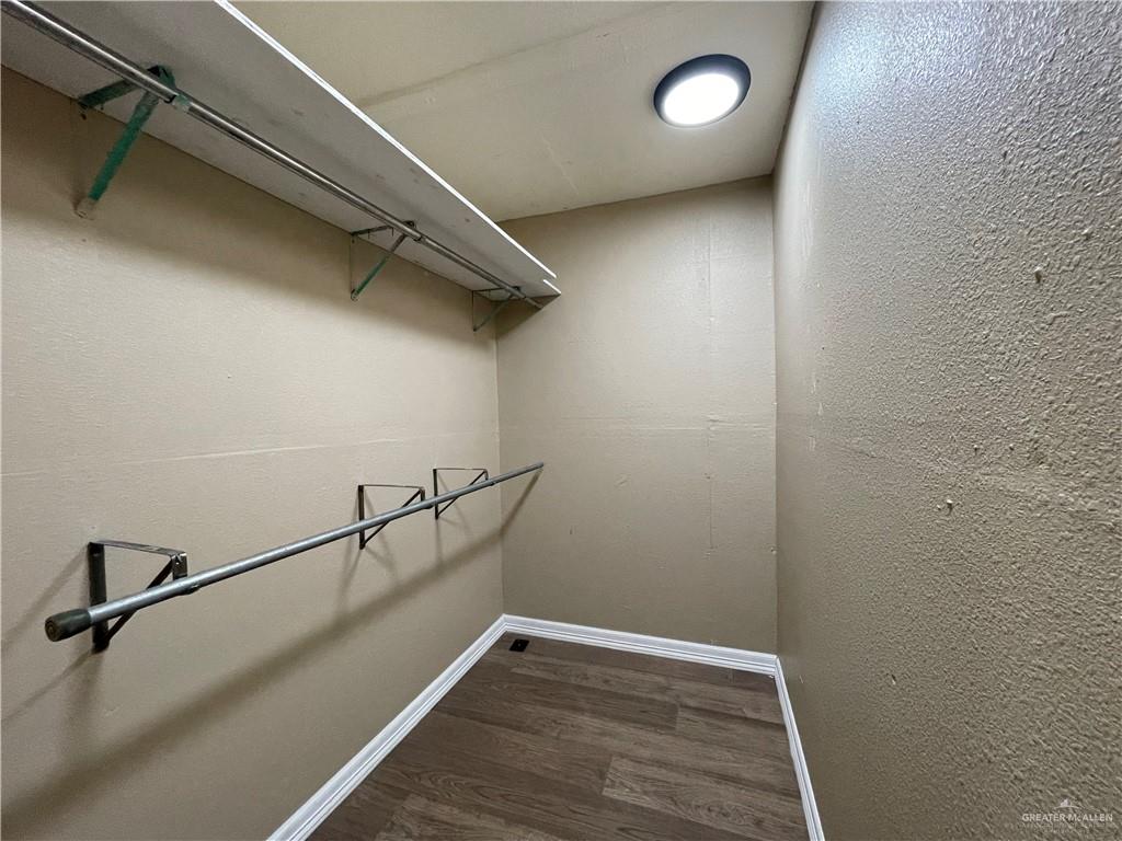 8006 Senecio Street Mission, TX 78574 - Photo 9 of 31 a view of a room with racks on the wall