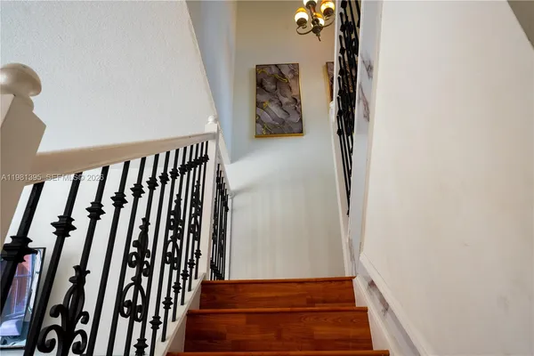 a view of staircase with white walls