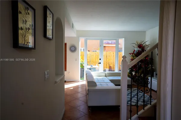 a living room with furniture and a window