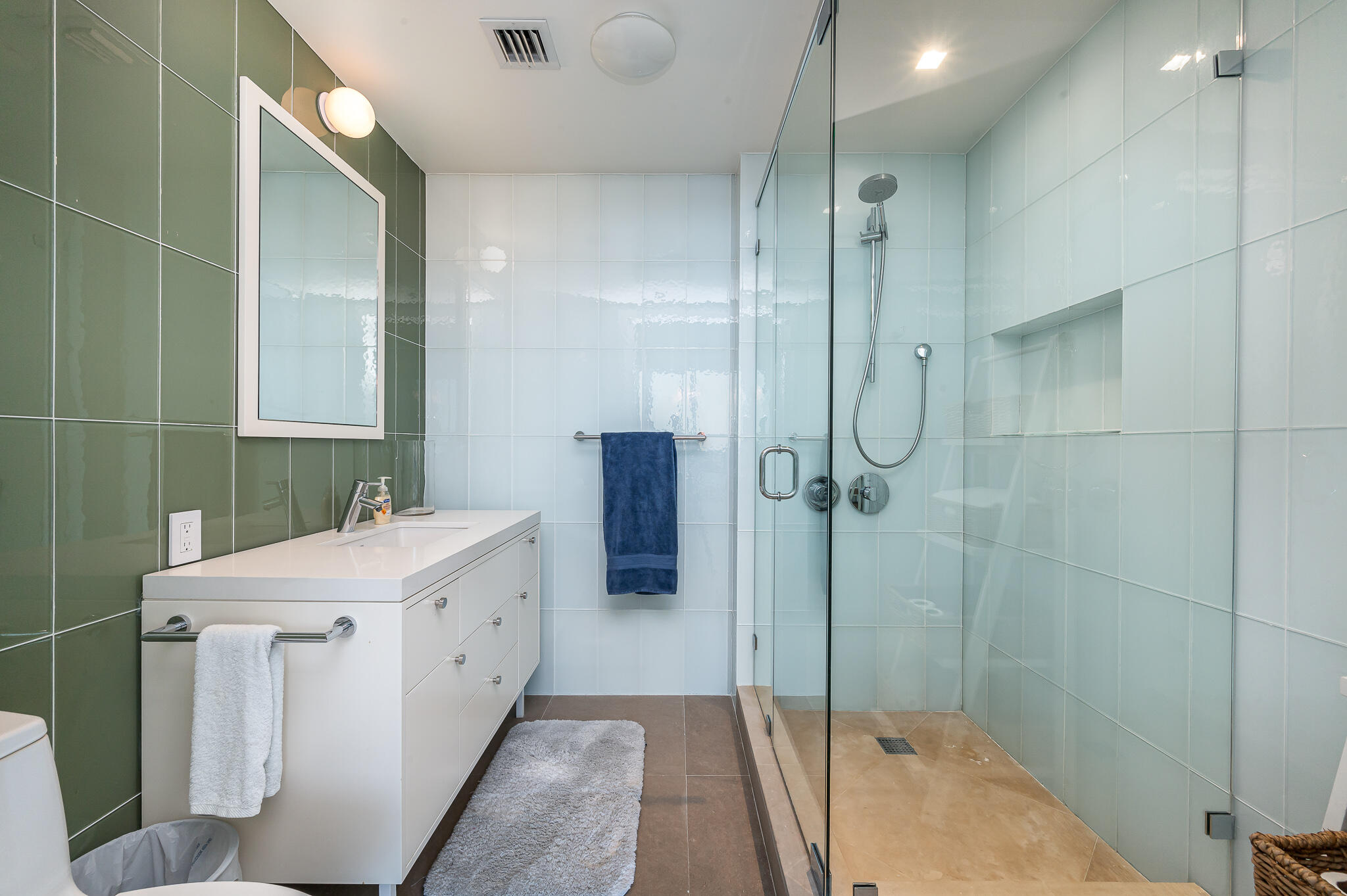 400 Alton Road, Unit 1808 Miami Beach, FL 33139 - Photo 12 of 17 a bathroom with a double vanity sink a toilet and shower