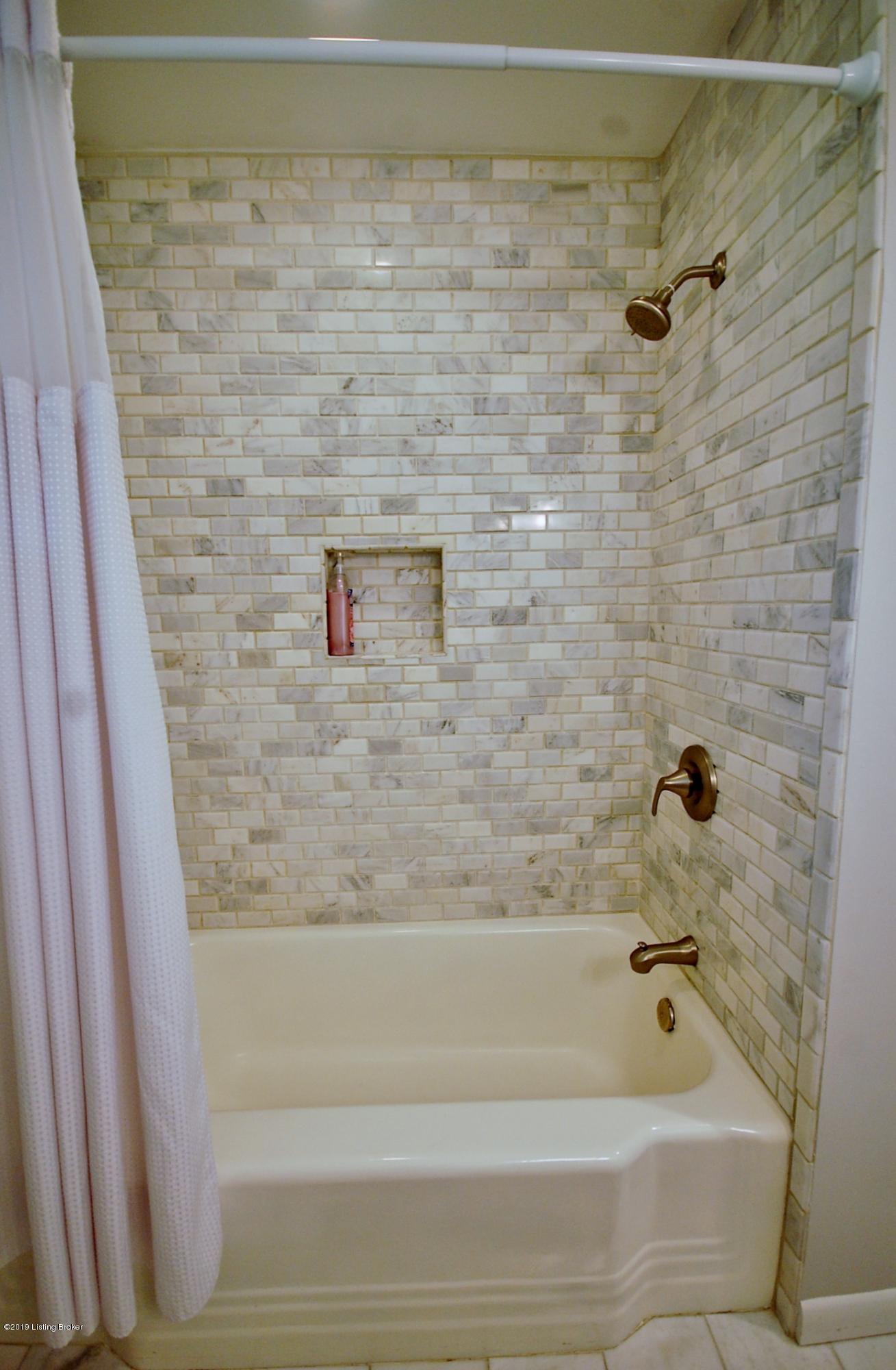 714 Antrim Road Louisville, KY 40207 - Photo 31 of 51 Hall Bathroom is equipped with a combination tub-shower