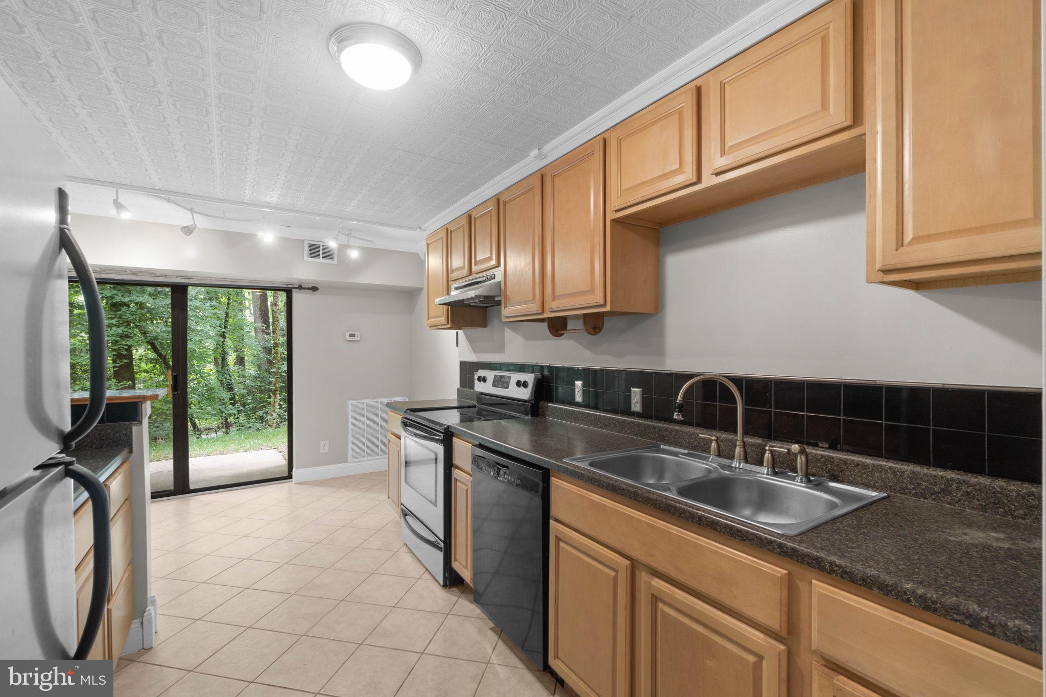 11661 Stoneview Square, Unit 1B Reston, VA 20191 - Photo 4 of 37 Ceramic tile flooring in the kitchen.