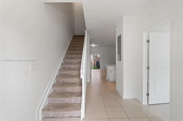 a view of entryway and hall with a hallway