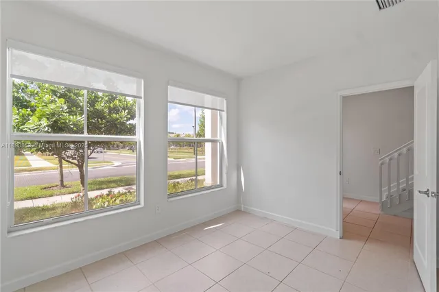 a view of an empty room with a window