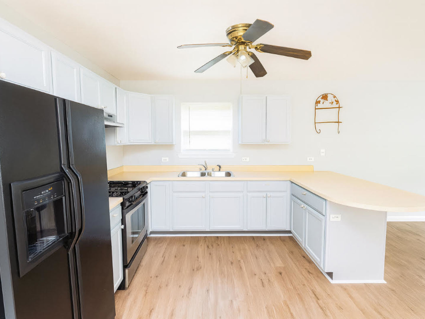 1712 11th Street Waukegan, IL 60085 - Photo 5 of 9 a kitchen with a refrigerator and a sink