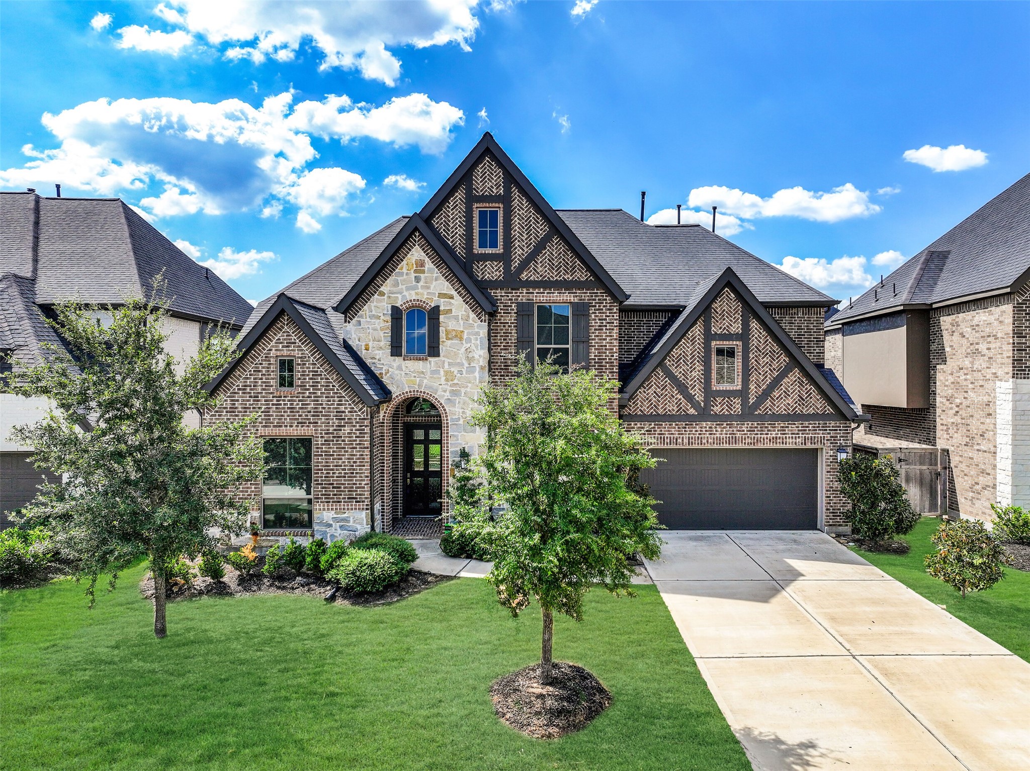 28907 Ridge Valley Court Fulshear, TX 77441 - Photo 1 of 36 a front view of a house with a yard and garage