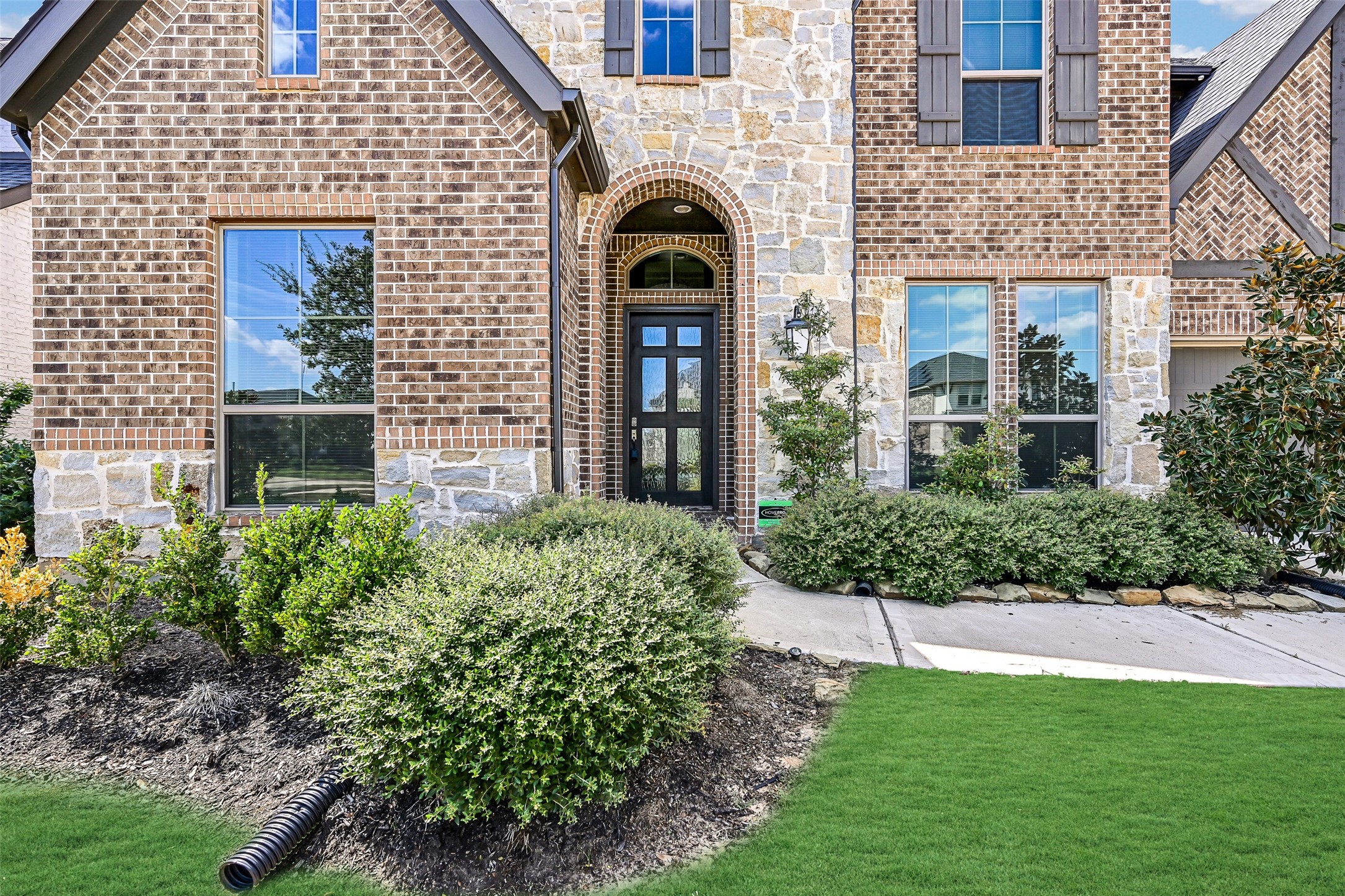 28907 Ridge Valley Court Fulshear, TX 77441 - Photo 2 of 36 a front view of a house with garden