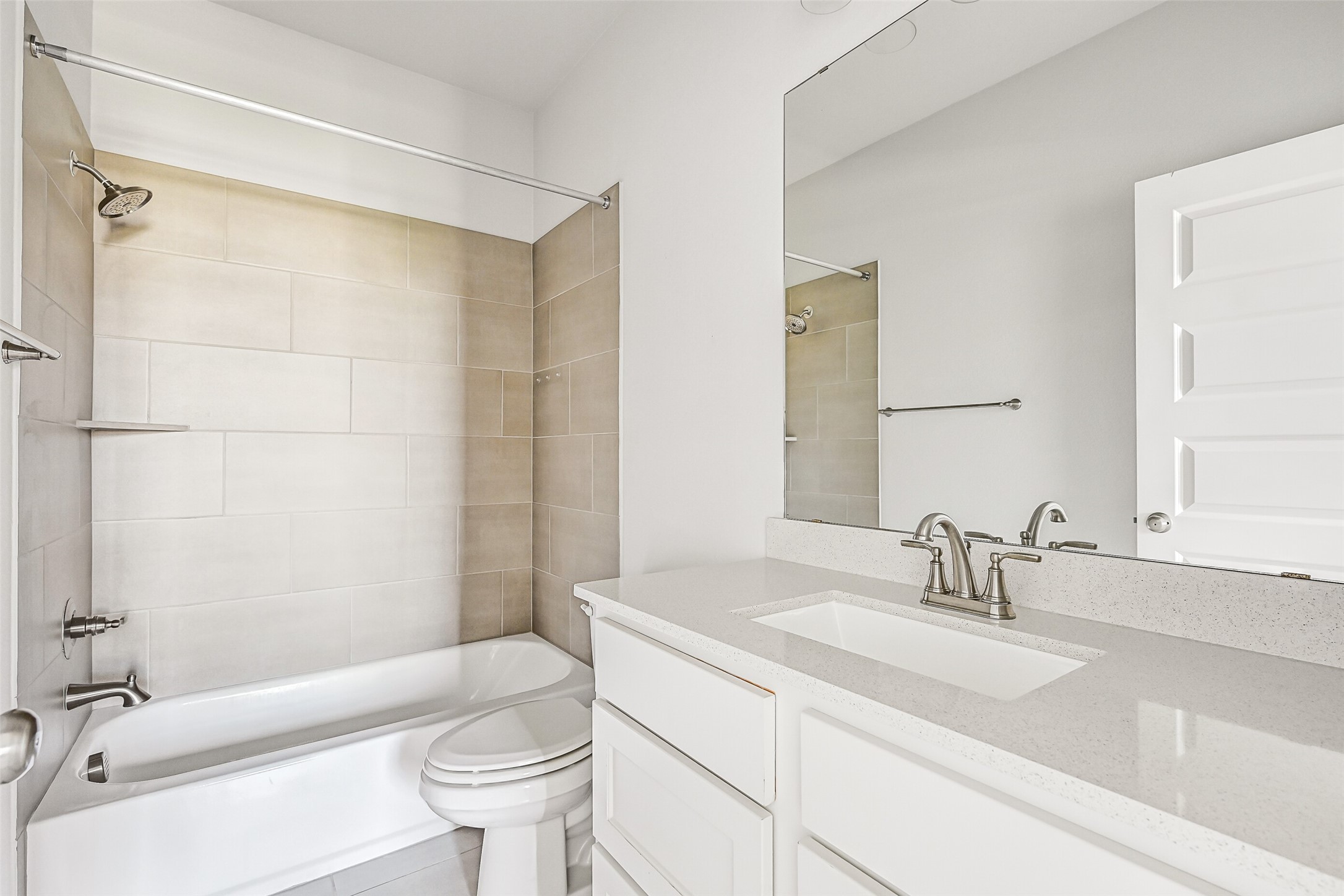 28907 Ridge Valley Court Fulshear, TX 77441 - Photo 32 of 36 a bathroom with a sink a toilet and a mirror