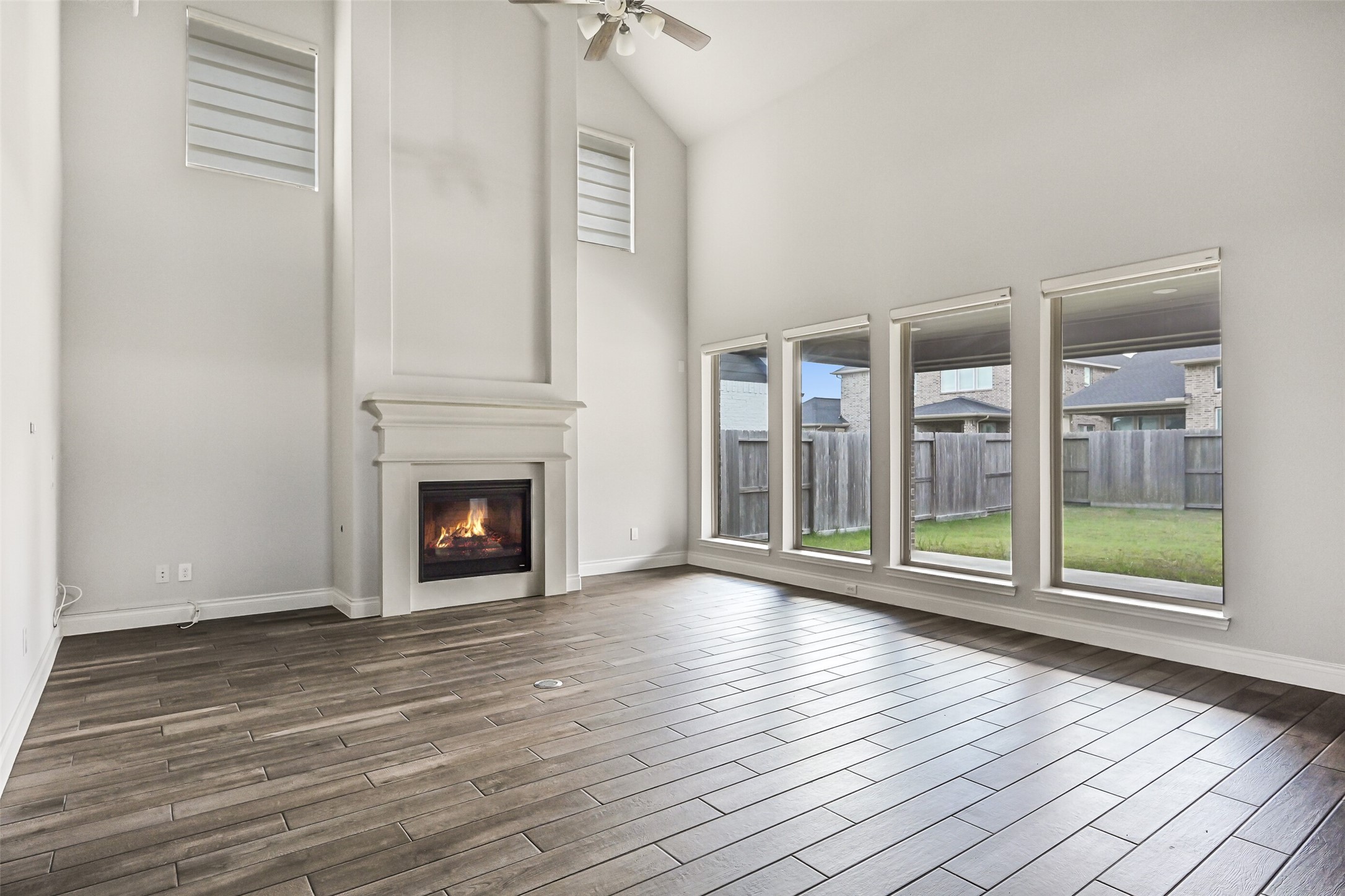 28907 Ridge Valley Court Fulshear, TX 77441 - Photo 5 of 36 a view of an empty room with wooden floor and a window