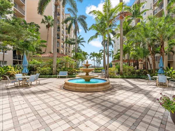 an aerial view of a city with lawn chairs