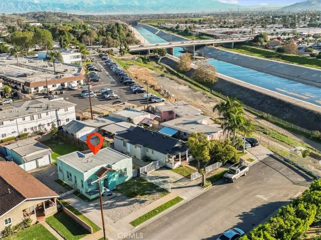 an aerial view of residential houses with outdoor space