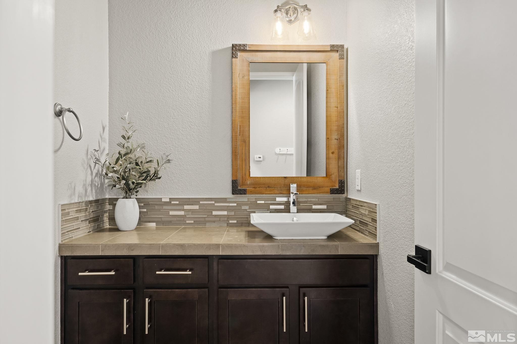 1755 Laurel Ridge Court Reno, NV 89523 - Photo 29 of 38 a bathroom with a sink and a mirror