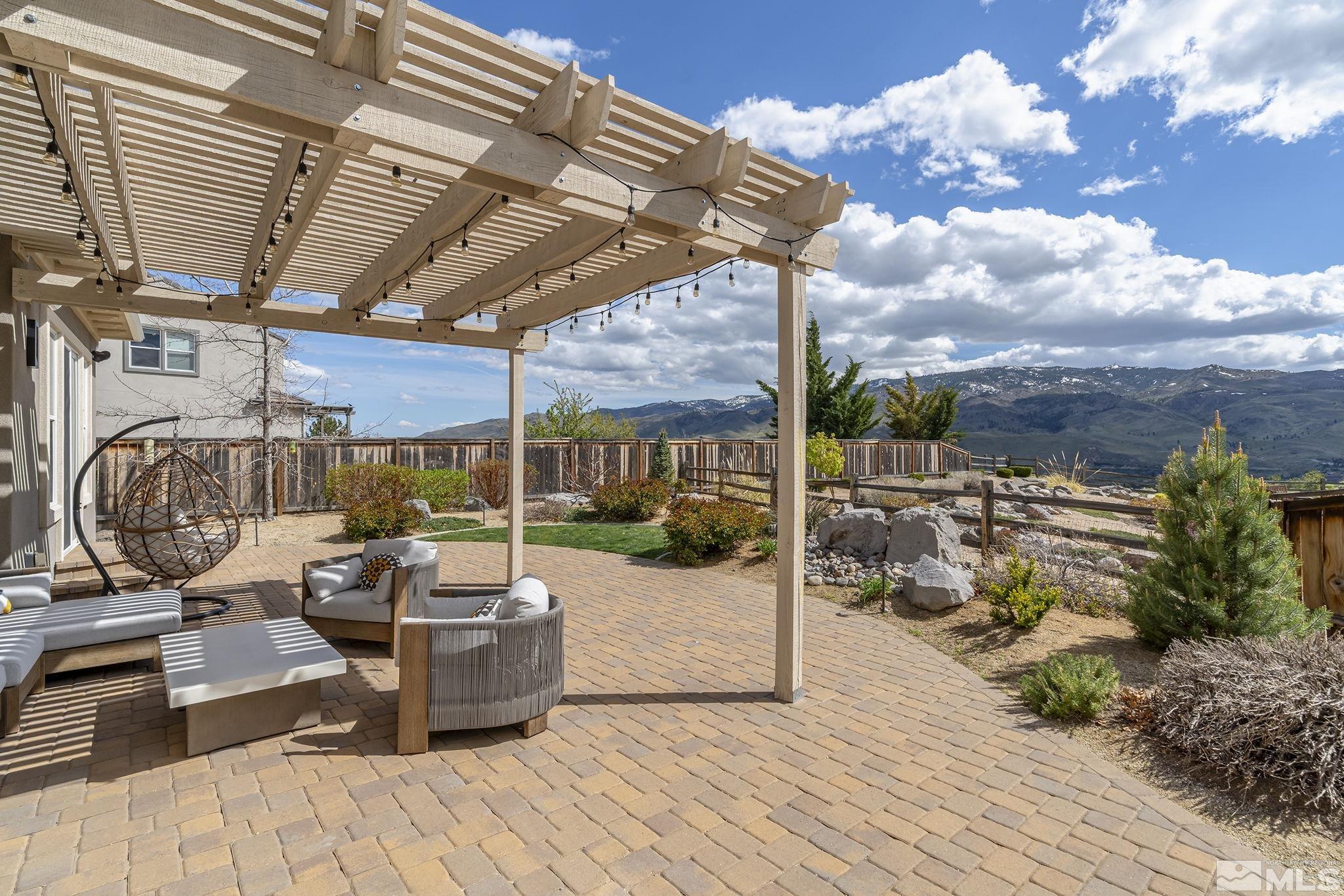 1755 Laurel Ridge Court Reno, NV 89523 - Photo 31 of 38 a view of a patio with a table chairs and a potted plant