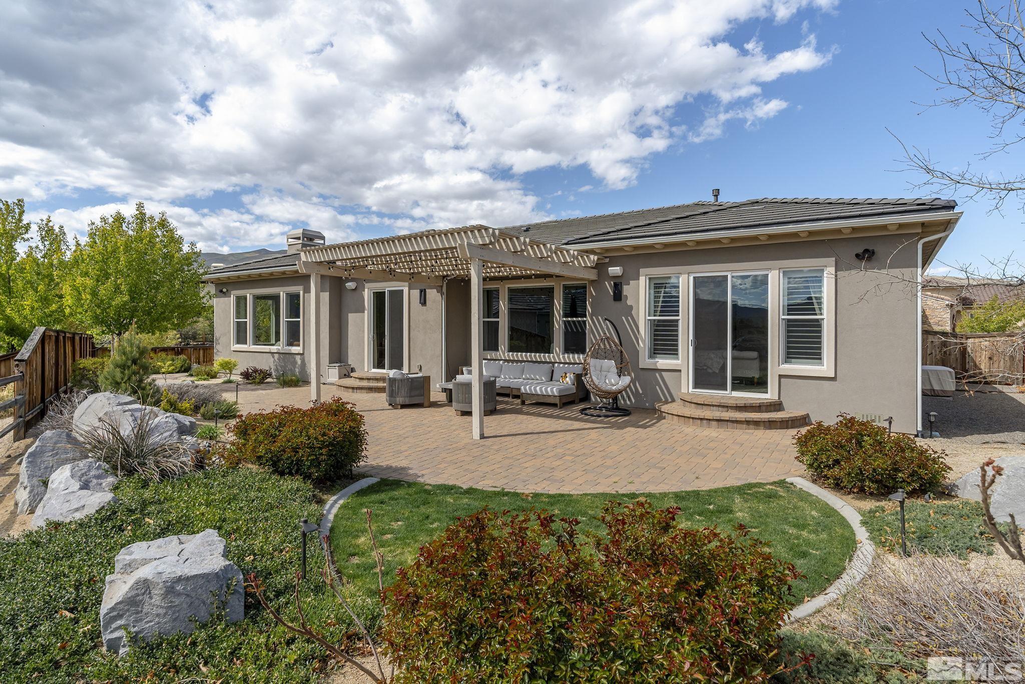1755 Laurel Ridge Court Reno, NV 89523 - Photo 35 of 38 a view of a house with backyard sitting area and porch