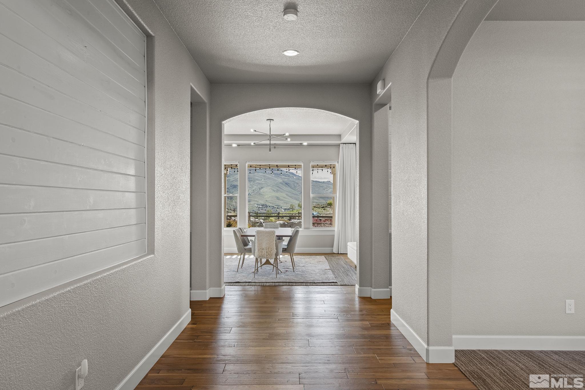 1755 Laurel Ridge Court Reno, NV 89523 - Photo 4 of 38 a view of a hallway with wooden floor and windows