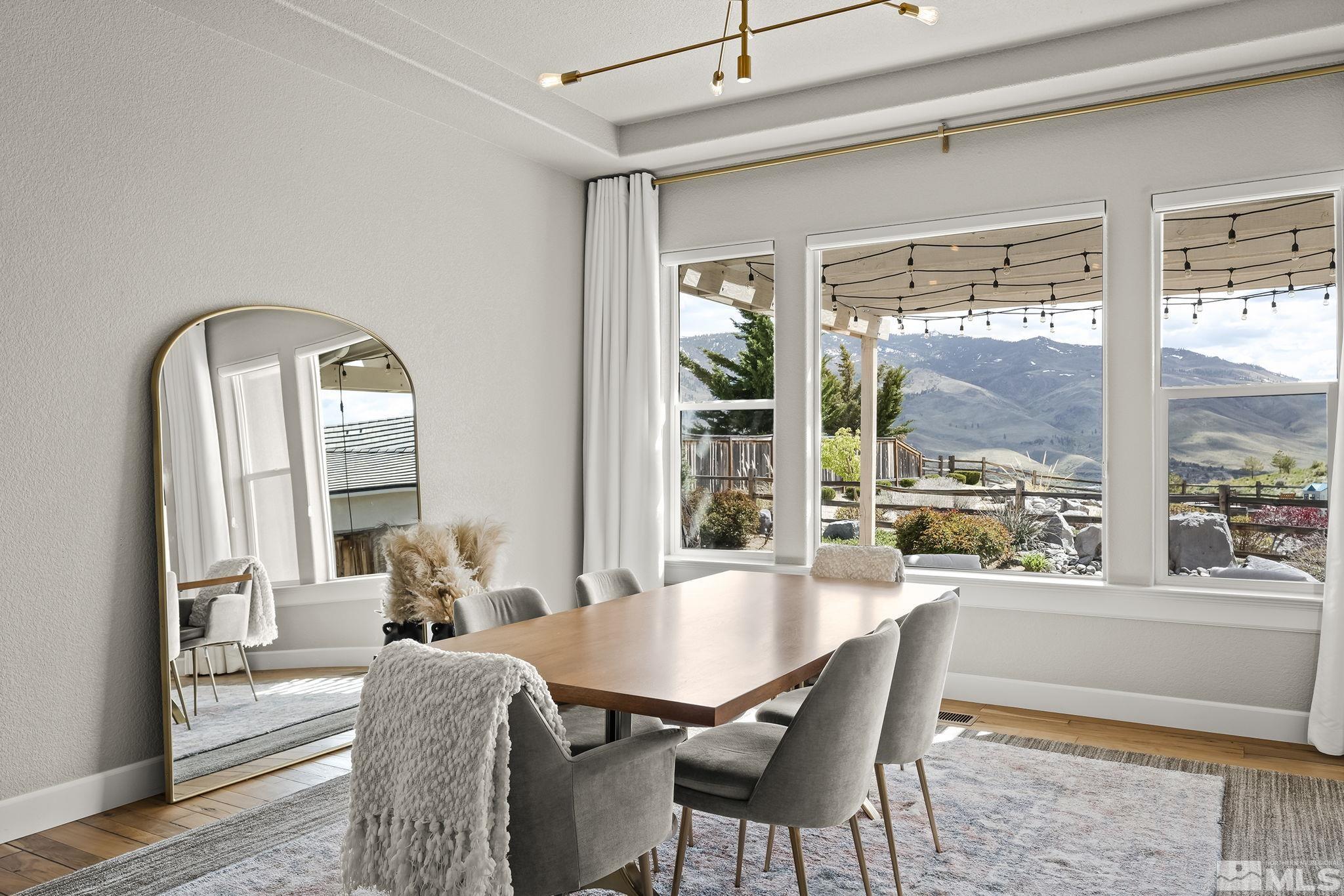 1755 Laurel Ridge Court Reno, NV 89523 - Photo 6 of 38 a dining room with furniture a chandelier and wooden floor