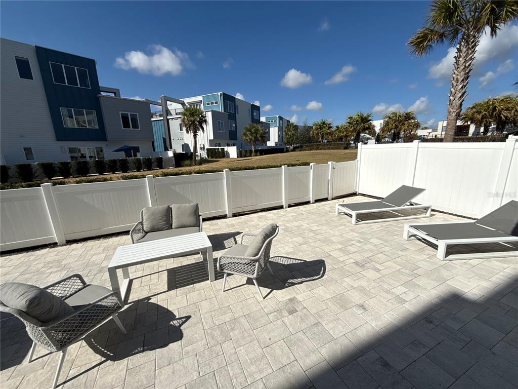 7740 Sandy Ridge Drive, Unit 120 Reunion, FL 34747 - Photo 27 of 36 a view of a chairs and table in patio
