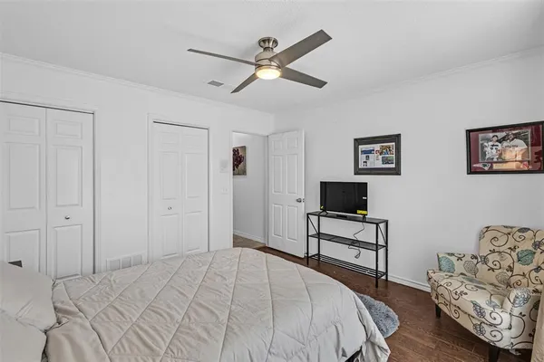 a bedroom with a bed and a couch