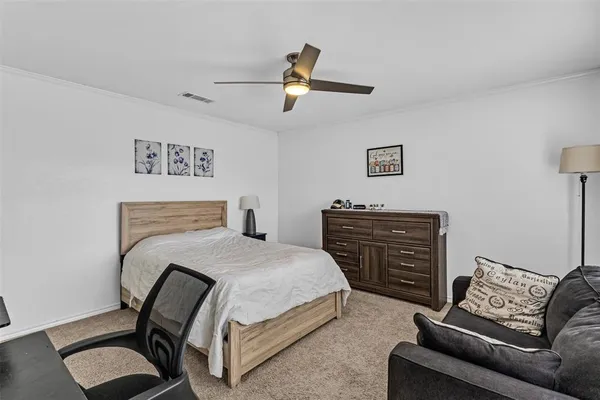 a bedroom with a bed and furniture