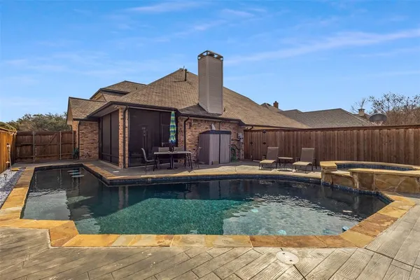 a view of a house with pool table and chairs